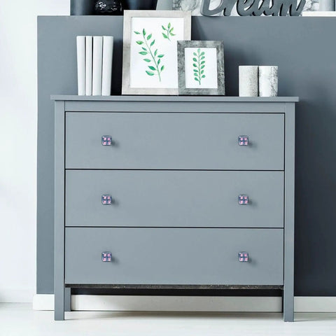 Gray dresser with 4 Pack Crystal Glass Cabinet Knobs With Screws Dope Pink Axolotl Design in a room decor setup.