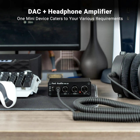 Q4 DAC Headphone Amp For PC And Home Audio Setup With USB Optical Coaxial Inputs, 3.5mm Headphone Output And RCA Speaker Outputs, Plug And Play Desktop Digital To Analog Converter For Richer Music, Gaming, And Movies. black metal DAC on desk with headphones