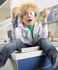 Child in a lab coat wearing Science Party Favors Silicone Bracelets Bulk Multicolor Lab Wristbands Set 36 Pcs For Back To School Classroom Gifts And Party Supplies Kid Friendly Great For Science Fairs Birthdays Teen And Adult Lab Activities