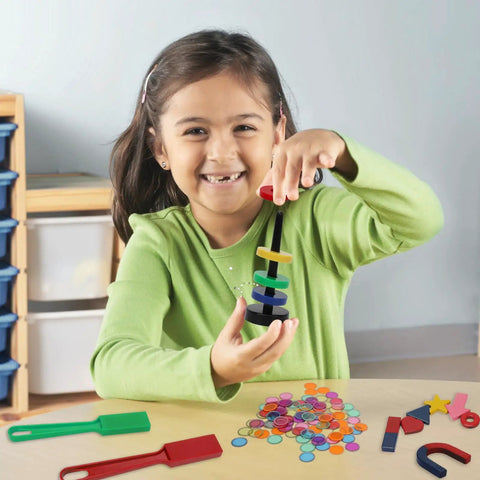 Child using 228 Piece Magnetic Science Kit For Kids With Magnetic Balls Chips And Wands 7 Shaped Magnets And Post With Rings