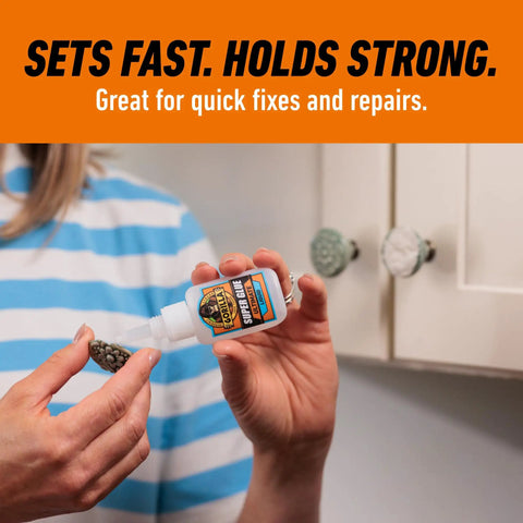 Person using Ultimate Clear Super Glue 15 Grams Heavy Duty Fast Set Bond For Quick Fixes And Home Repairs With Anti Clog Cap