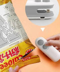 Using 2 In 1 Portable Bag Sealer And Cutter With Rechargeable Battery Handy Handheld Heat Sealer for sealing a chips bag securely.