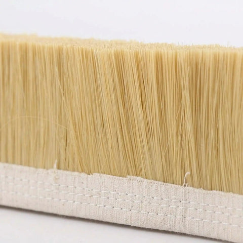 Close-up of the Clean Sweep Cnc Vacuum Brush 100Mm By 1M Length For Milling And Engraving Gear bristles on canvas base.