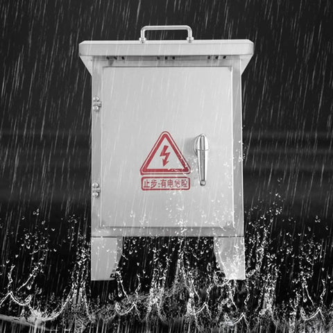 Weatherproof Stainless Steel Electrical Junction Box With Lock And Mounting Plate For Outdoor Use, Heavy Duty Enclosure To Protect Electrical Equipment From Rain, Dust, Snow And UV Rays. Front view in heavy rain