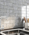 Tile Peel and Stick Backsplash 3x6 Grey Marble Subway Self-Adhesive Waterproof for Bathroom and Kitchen Wall Tiles No Grout Removable Easy Install RV Fireplace in a modern kitchen above a sink.