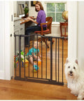 Portico Arch Baby Gate for Doorways and Hallways, heavy duty metal with pressure mount, installed in a home interior with child and pet.