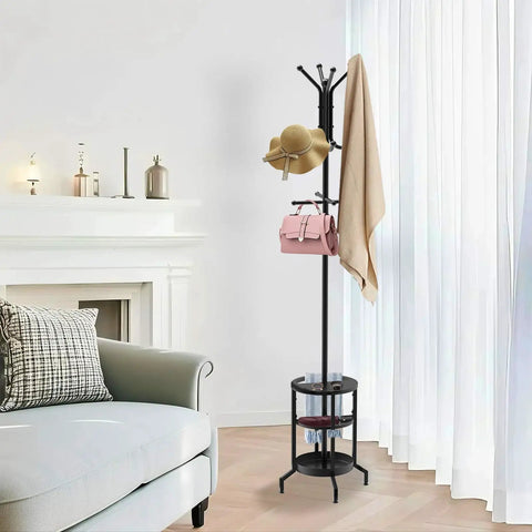 Dope Freestanding Coat Rack With 12 Hooks And Umbrella Holder beside the sofa in a living room, with hats and bags hanging