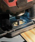 Router using Six Piece Keyhole And T Slot Router Bit Set With 1 Quarter Inch Shanks for precision wood cutting on a wooden surface.