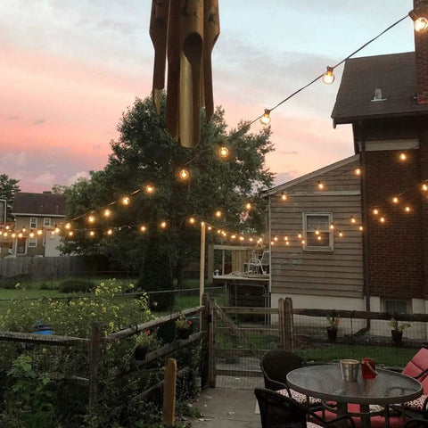 Outdoor String Lights 50ft Connectable Patio Lighting With 52 G40 LED Bulbs Warm White 2200K hung in backyard at sunset