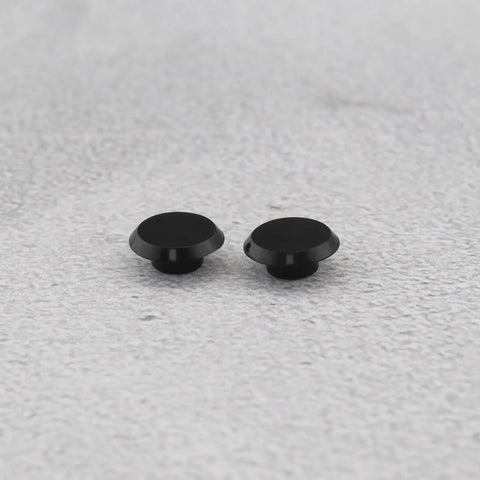 Black 50 Pack Socket Head Screw Cover Caps For M6 Allen Screws on gray surface, durable plastic for indoor and outdoor use