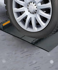 Self Adhesive Anti Skid Rubber Car Parking Guide Mat in use with reflective strip, guiding a car tire for precise parking.