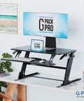 36 Inch Wide Standing Desk Converter For Dual Monitors Sit To Stand Workstation Height Adjustable Up To 17.3 Inches With Large Keyboard Tray Black Easy Install Ergonomic Durable Pro Grade on office desk