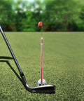 Golf club with Magnetic Alignment Rod for Golf Swing Training Aid in red, showing club face alignment and swing path visualization.