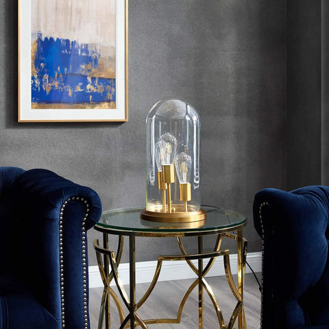 Vintage Brass Glass Cloche End Table Lamp With Industrial Modern Vibe on round table between blue armchairs