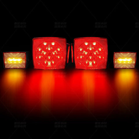 LED Trailer Light Kit 12V Submersible Tail Marker Lights With Wiring Harness For Boat Car Truck RV Utility Snowmobile Stop Turn Reverse DOT Certified Road Ready, illuminated red and amber lights on black background