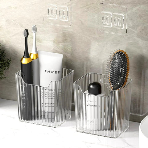 Four Pack Clear Wall Mount Organizers With Super Strong Adhesive Perfect For Kitchen Cabinets And Pantries Food Grade Storage Bins Stackable Desktop Baskets holding toiletries and brushes.