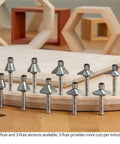 Pro Grade Badass Chamfer Router Bit Five Piece Set With One Quarter Inch Shank And Three Flute Twin Pilot Bearing Carbide Tips on wood.