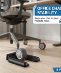 4 Pack Black Rubber Anti Slip Wheel Stoppers Lock Down Rolling Furniture With No Sweat Setup Keeps Office Chairs And Appliances Locked In Tight While Saving Hardwood Floors From Slippery Mishaps Built Tough For Real Everyday Use under an office chair on hardwood floor.