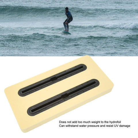 Beefy Lightweight PVC Foam Box For Hydrofoil Mounting with track rail, black finish, shown with ocean backdrop and surfer using hydrofoil