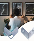 Rock Solid L Shaped Corner Brace Brackets 30 Pack 35x13mm supporting picture frames on a wall with a person hanging photos.