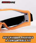 Close-up of Wide Vision Safety Glasses With Anti-Fog And Anti-Scratch Wraparound Lenses Adjustable Strap, focus on rubber frame.