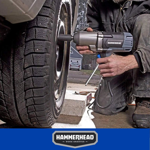 Mechanic uses Beefy 7.5 Amp 1/2 Inch Impact Wrench Delivers 240 Ft-Lbs Torque, 2200 RPM, 2700 IPM With Friction Ring Anvil on car tire