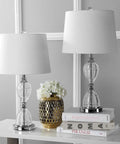 Clear Crystal LED Table Lamp Set Of 2 With Dope Glam Hourglass Design White Linen Shade Chrome Finish on white table.
