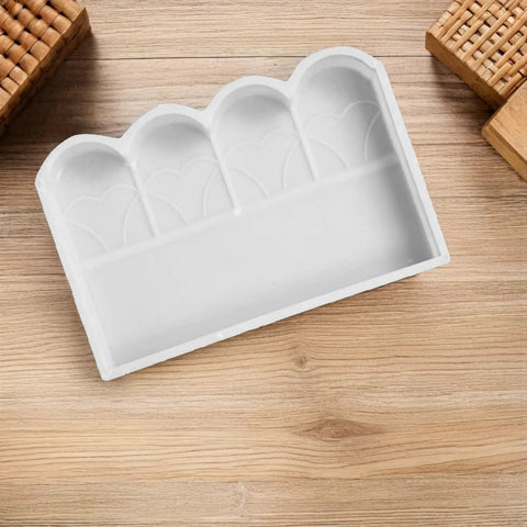 White plastic Garden Fence Concrete Mold For DIY Projects Reusable Plastic Cement Brick Mold For Courtyard Rail Patio Sidewalk Lawn Edging 17.32x11.69 Inch Form Kit on wooden surface.
