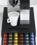 Keep Your Kitchen Game Tight With This Metal Coffee Pod Drawer Holds Sixty Nespresso Capsules Effortless Slide Design Lets You Snag Pods Without Breaking A Sweat, featuring a coffee maker and a white cup on the drawer.