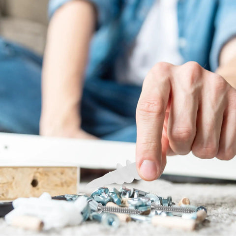 Person assembling with Drywall Anchors Kit With Plastic Expansion Tubes And Screws 50 Heavy Duty Sets Made From Stainless Steel