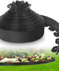 DIY Friendly No Dig Landscape Edging Kit 4-Inch By 50 Feet With 75 Spikes Flexible Plastic Border in use around flower bed