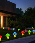 Mushroom Solar Lights for Outdoors Pack of 6 LED Garden Stake Decor with 8 Modes lighting up a yard at night