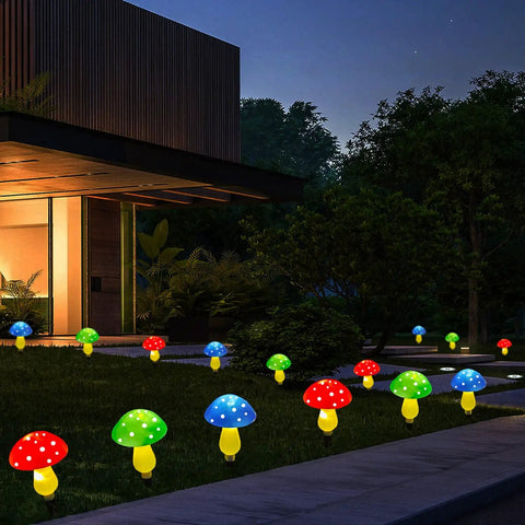 Mushroom Solar Lights for Outdoors Pack of 6 LED Garden Stake Decor with 8 Modes lighting up a yard at night