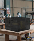 Boss Grade Miter Saw Cover Portable Table Sheet Protector With Beefy 420D Oxford Fabric All Weather Dust Guard Fits Most Planers And Garage Gear Solid Black Size 27 By 24 By 19 Inches in a workshop setting.