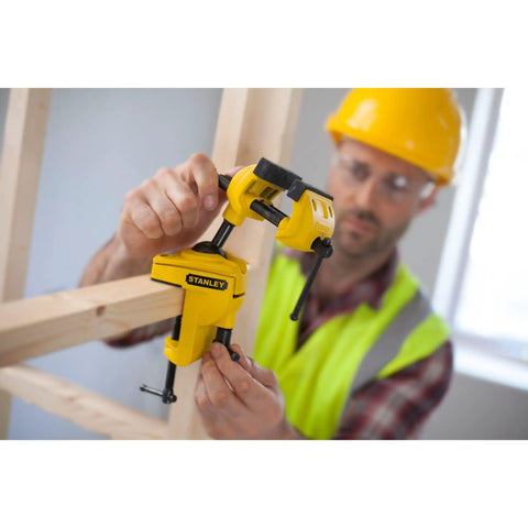 Worker using MaxSteel Multi Angle Hobby Vice With 360-Degree Ball Joint on a wooden frame, yellow and black design.