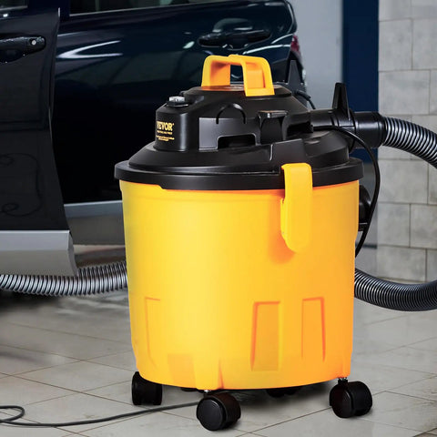 Five Gallon Wet Dry Shop Vacuum 60 CFM 6 HP Peak Power Beast Suction Portable 3 In 1 with Filter Hose beside car in garage