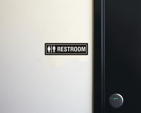 Unisex Restroom Sign 7 Inch By 2 Inch Metal With Self Adhesive Backing For Office Home Bathroom Wall Or Door Decor Easy Mounting UV Protected Black 2 Pack on wall beside a door