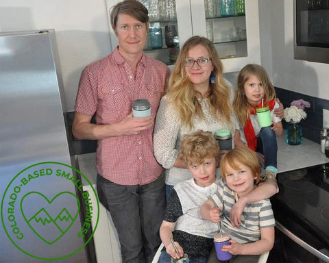 Family in kitchen holding mason jars with 10 Pack Wide Mouth Platinum Silicone Sealing Rings Gaskets For Mason Jar Lids Leak Proof And Air Tight Reusable Seals Durable Fits 3 Inch Wide Mouth Jars For Fresh Food Storage And Easy Preserving.