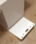 Premium Appliance Moving Sliders With Pull Strap For Tile And Hardwood Floors shown on wooden floor, sliding under appliance.