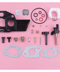 Carburetor Repair Kit For Honda GX110 GX120 GX140 GX160 And Lifan 168 Power Equipment Parts Plug And Play Replacement Set For Durable Performance Smooth Starts Reliable Engine Run Long Lasting. gasket and jets on pink background