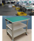 Heavy Duty Aluminum ESD Mobile Work Cart With Anti Static Rolling Bench And Locking Wheels For Electronics Assembly Or Home Garage Project That Moves Smooth Daily in a lab setting.