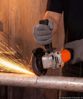 Badass Hustle Ready 4.5 Inch Angle Grinder 1400W High Amp Electric Motor in action cutting metal with sparks.