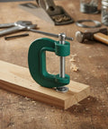 Heavy Duty Quick Adjust G Clamp For Woodworking And DIY Projects securing wood on a workbench for precise cutting.
