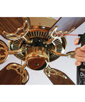 Two Pack 10 Oz Compressed Gas Dusters for Quick Cleaning of Electronics like Keyboards CPUs Mice and Workstations in use on a ceiling fan