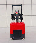 The Ultimate Full Electric Walkie Pallet Stacker With 1000kg Or 1500kg Capacity And A Smooth 3000mm Lift Height, red unit with controls.