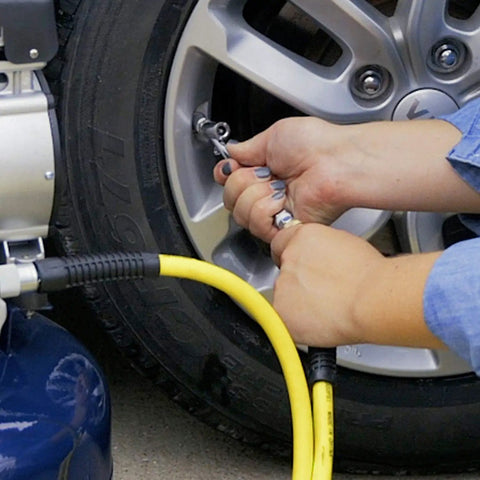 Using 17 Piece Compressor Inflation Kit With Blow Gun, Air Chucks And Inflation Needles on car tire from home garage set.