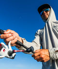 Angler casting with Max Pro Spinning Rod And Reel Combo 6 Foot 10 Inch, Size 2500 Reel, 8 Stainless Steel Ball Bearings fishing setup