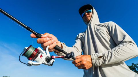 Angler casting with Max Pro Spinning Rod And Reel Combo 6 Foot 10 Inch, Size 2500 Reel, 8 Stainless Steel Ball Bearings fishing setup