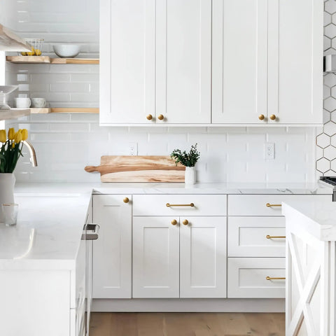 Modern kitchen with Vintage Antique Brass Drawer Pulls 10 Piece Set For Cabinets And Vanities on white cabinets.