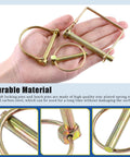 Hand holding parts of a 254 Piece Mixed Lynch And Clevis Pins Set With 5 Styles Of Pin Fasteners for mechanics and automotive use.
